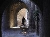 Aleppo / ALP: female silhouette on a dark alley - woman wearing an abayya (photographer: Alejandro Slobodianik)