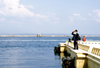 Odessa, Ukraine: old bearded man looking at the Black Sea - pier at Odessa harbor - photo by K.Gapys