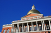 Boston, Massachusetts, USA: Massachusetts State House - elevated portico with Corinthian columns - red brick walls, white pillars and trim, and golden dome catching the sun - photo by M.Torres