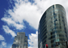 Kansas City, Missouri, USA: glass facades and sky - H&R Block Headquarters tower with One Kansas City Place in the background - photo by M.Torres