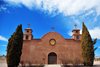 San Antonio, Socorro County, New Mexico, USA: Spanish colonial style church dedicated to San Antonio - adobe facade flanked by cypresses - intersection of US 380 and Interstate 25 - photo by M.Torres