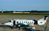 Warwick, Kent County, Rhode Island, USA:  T. F. Green Airport / Providence - Air Canada Express / Air Georgian Beechcraft 1900D C-GORZ (cn UE-134) twin-engine turboprop aircraft - pilot and co-pilot wait - photo by M.Torres