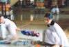 Cao-Dai temple: girl praying (photo by Nacho Cabana)