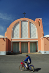 Layoune / El Aaiun, Saguia el-Hamra, Western Sahara: Spanish Cathedral - Sahrawi boy on a bike - photo by M.Torres