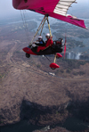 Victoria Falls - Mosi-oa-tunya, Matabeleland North province, Zimbabwe: aerial view of Victoria Falls and a Pegasus ultralight trike in flight - Zambezi River gorge on the basalt plateau - photo by C.Lovell